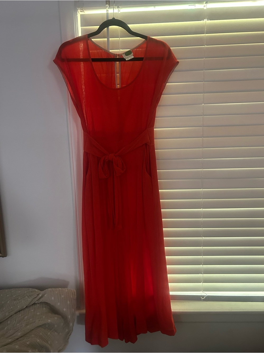 Orange Maeve jumpsuit from Anthropologie